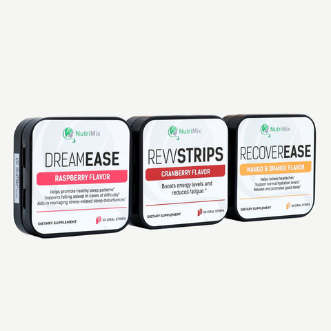 Three tins of NutriMix supplements, labeled 'DREAMEASE', 'REVSTRIPS', and 'RECOVEREASE', each with a different flavor: raspberry, cranberry, and orange & mango.